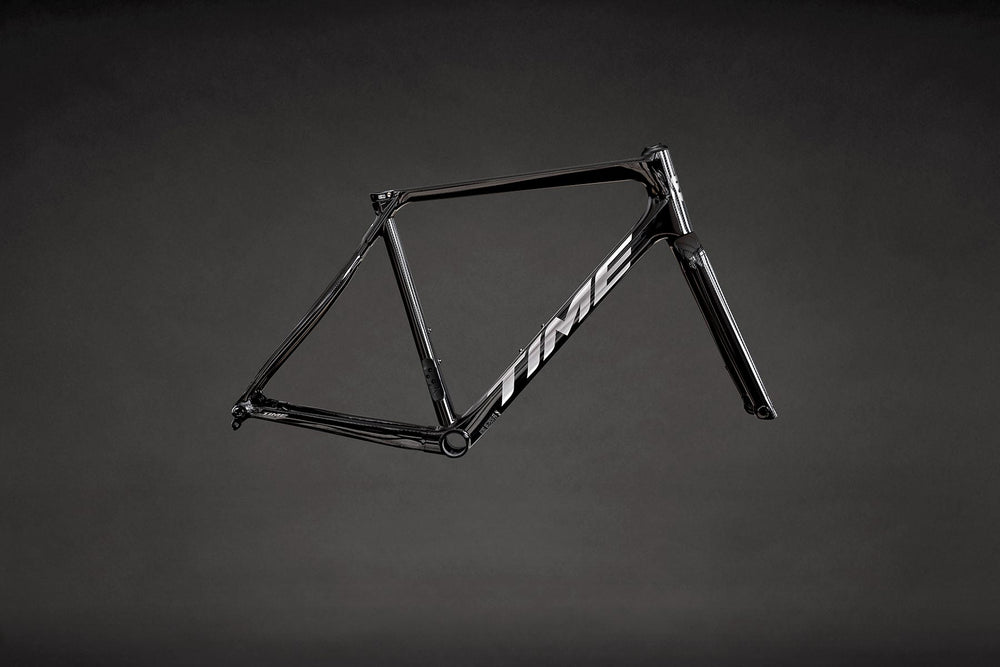TIME NXR road frameset in N01 Nude Carbon colorway, showing natural carbon fiber weave finish